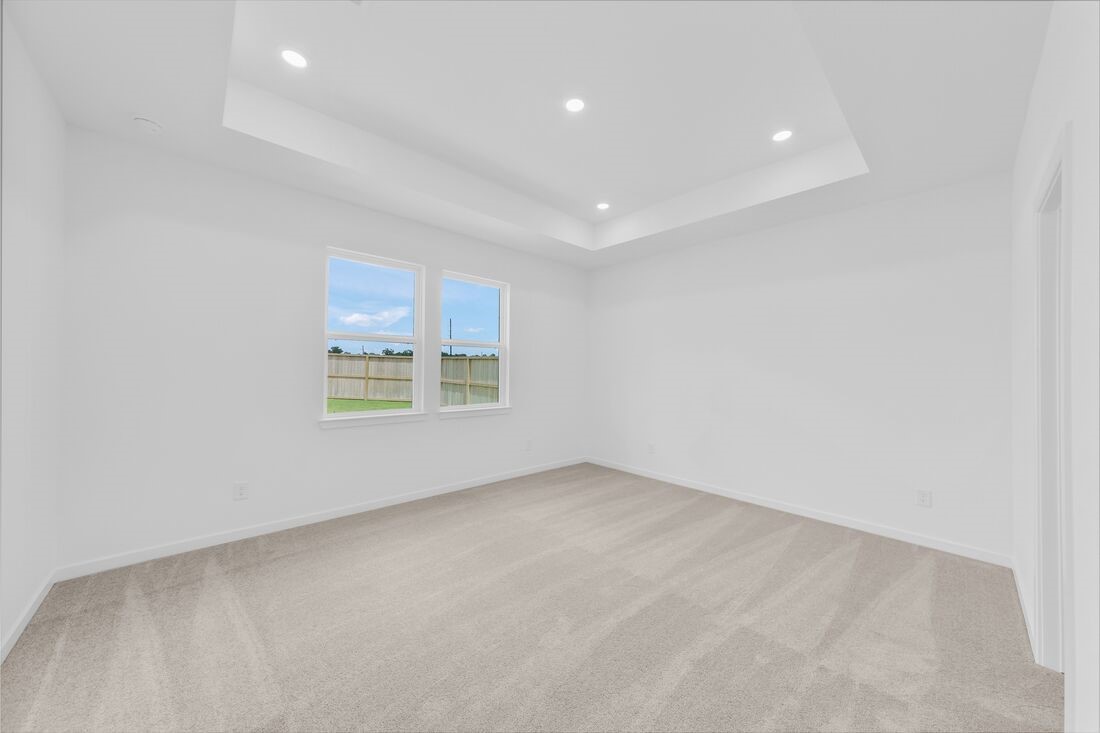 1107 Mattinson Rae Court Tomball, TX 77375 - Photo 6 of 32 an empty room with windows