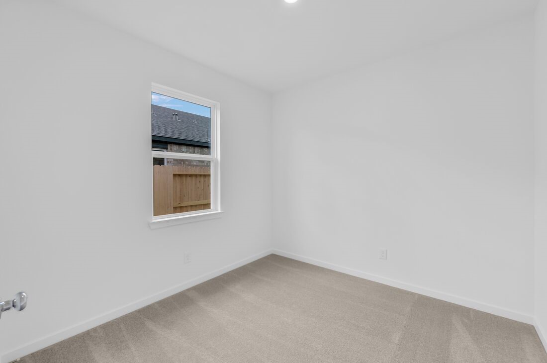 1107 Mattinson Rae Court Tomball, TX 77375 - Photo 9 of 32 a view of an empty room with a window