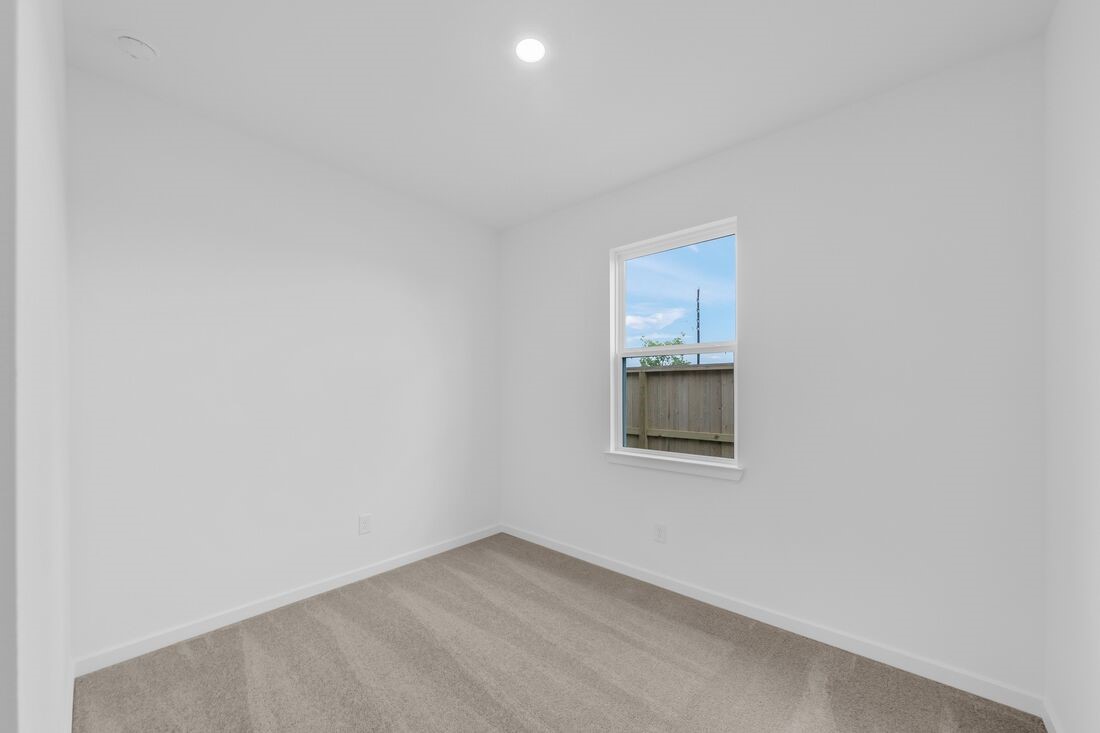 1107 Mattinson Rae Court Tomball, TX 77375 - Photo 10 of 32 an empty room with a window