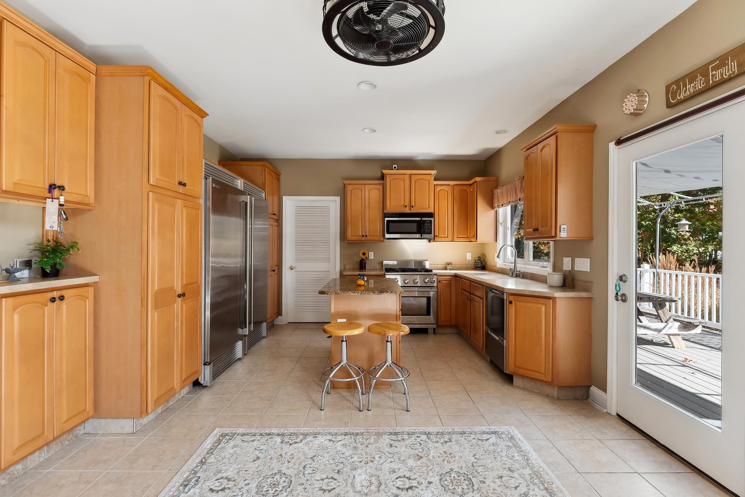 4 Mockingbird Woodbine, NJ 08270 - Photo 11 of 40 a living room with stainless steel appliances furniture a rug kitchen view and a large window
