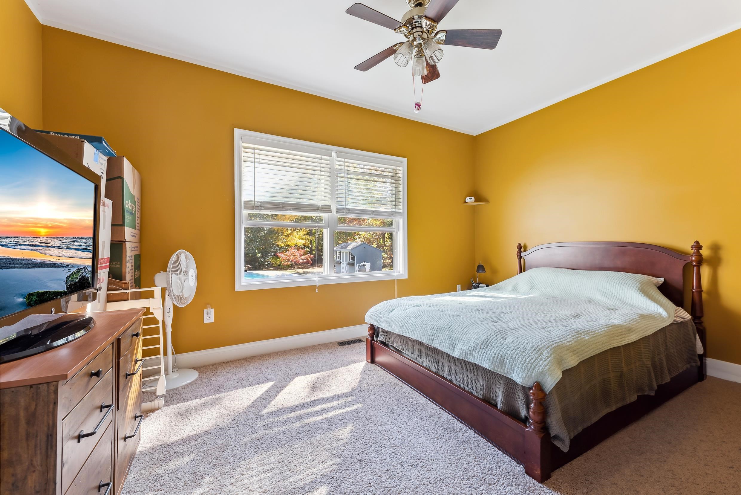 4 Mockingbird Woodbine, NJ 08270 - Photo 20 of 40 a bedroom with a bed and wooden floor