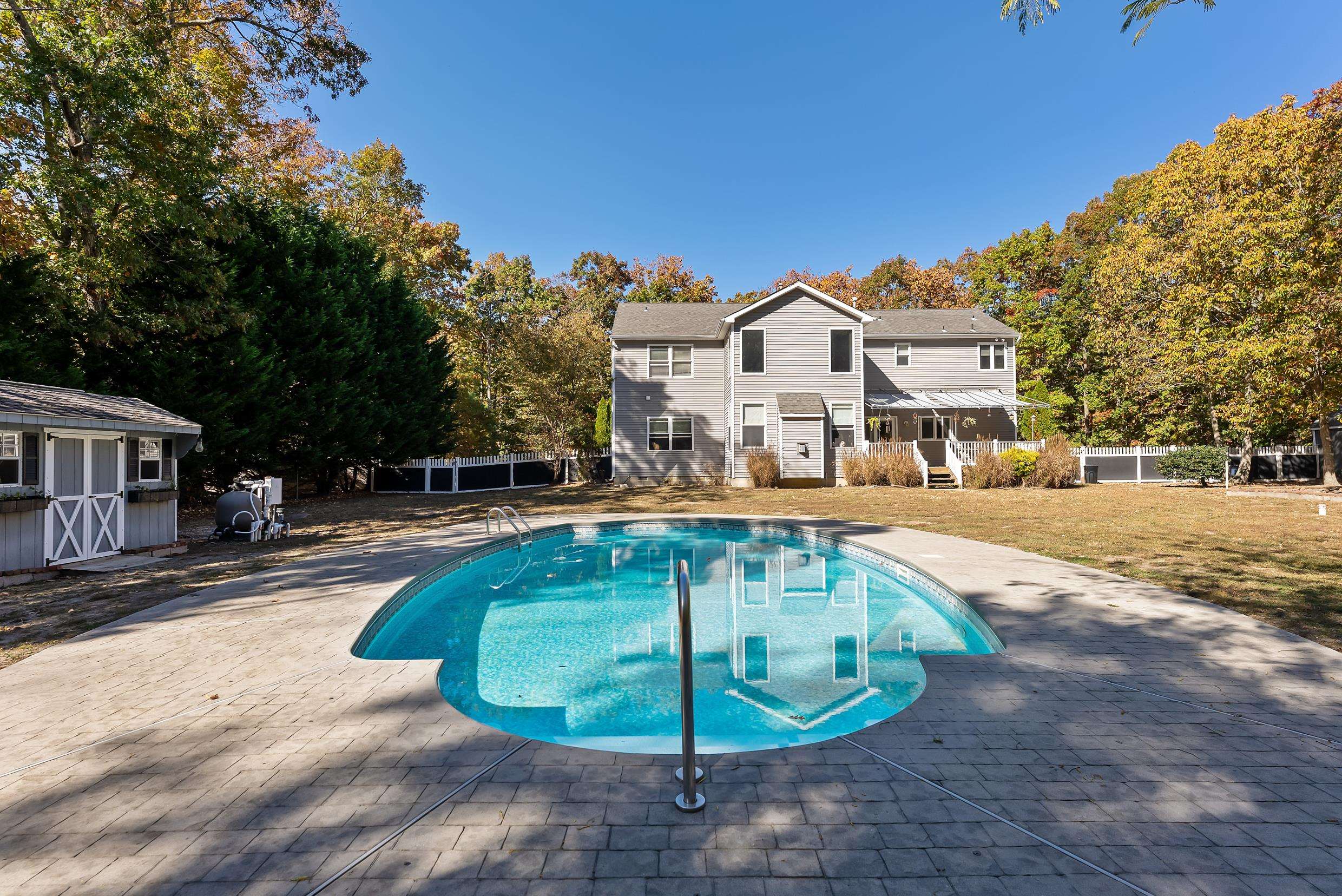 4 Mockingbird Woodbine, NJ 08270 - Photo 34 of 40 a view of a white house with a swimming pool