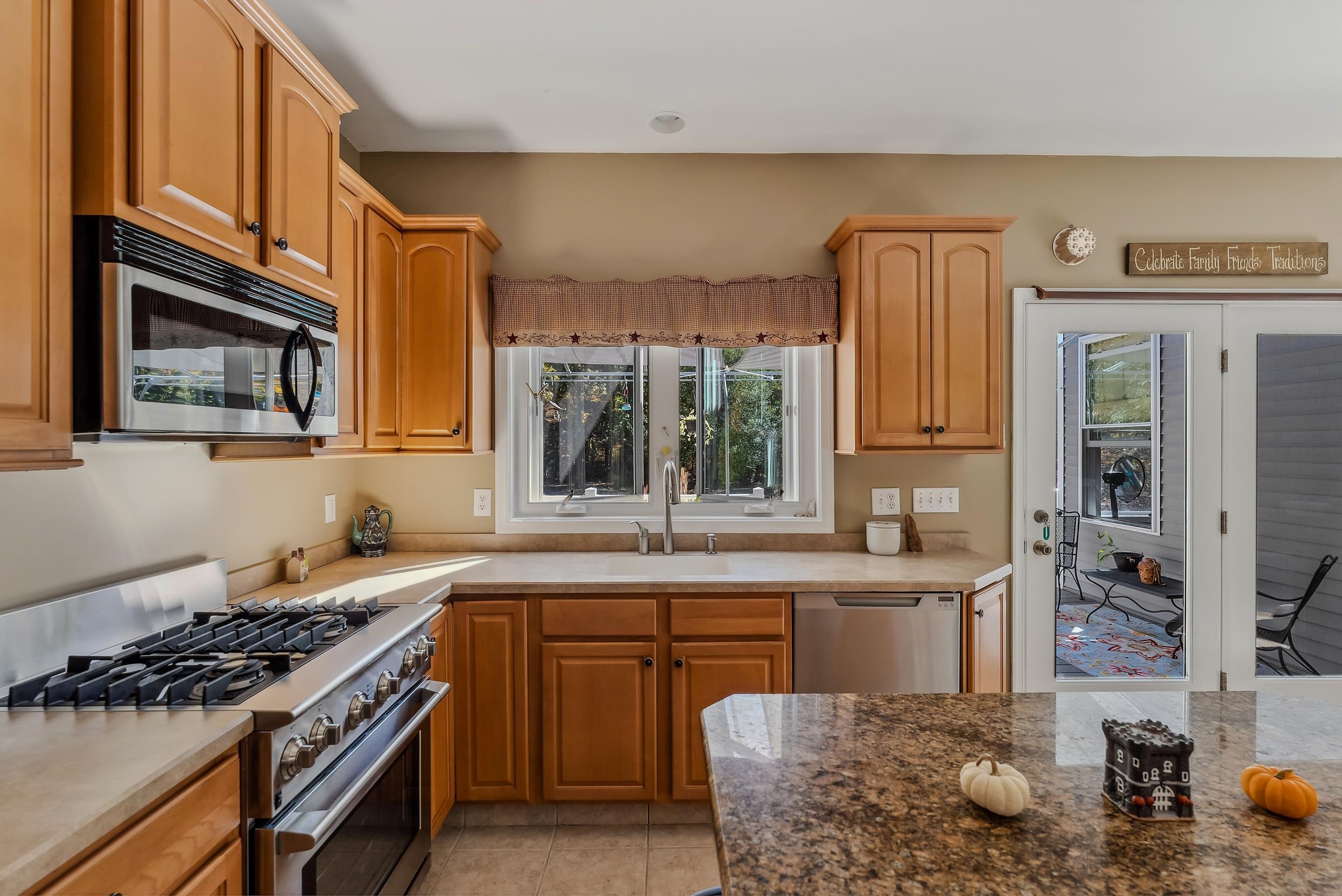 4 Mockingbird Woodbine, NJ 08270 - Photo 10 of 40 a kitchen with stainless steel appliances granite countertop a stove a sink and a refrigerator