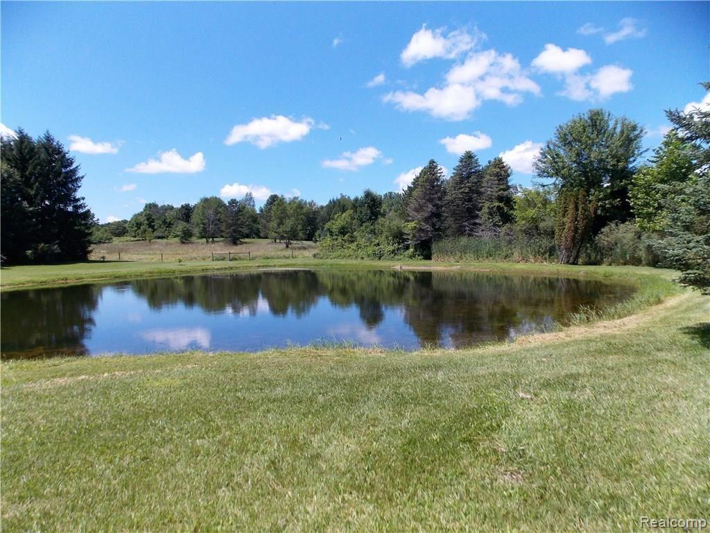 10221 Washburn Road Columbiaville, MI 48421 - Photo 33 of 37 Whether you might be swimming or fishing or just paddling across the water, there will be many family memories made at the waters edge.