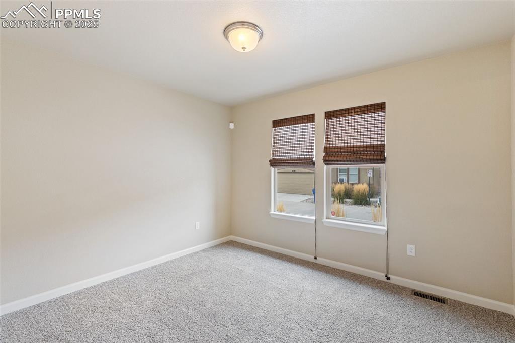 4139 Pk Hvn View Colorado Springs, CO 80917 - Photo 15 of 33 an empty room with windows