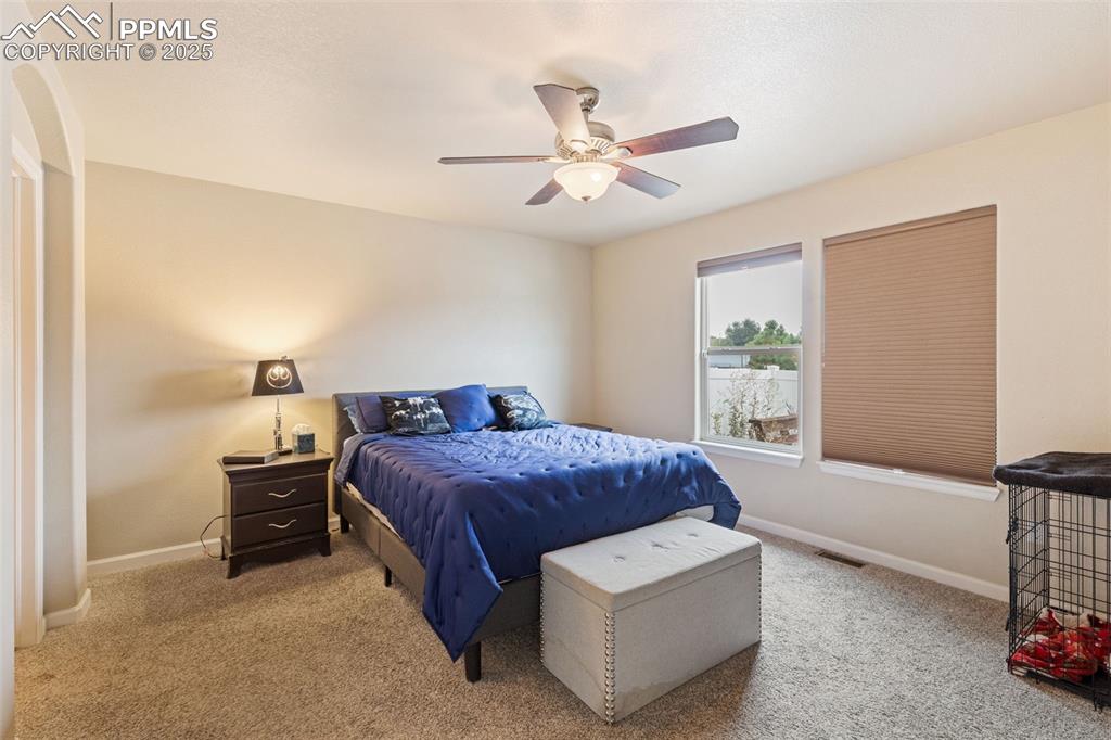 4139 Pk Hvn View Colorado Springs, CO 80917 - Photo 8 of 33 a bedroom with a bed and a window