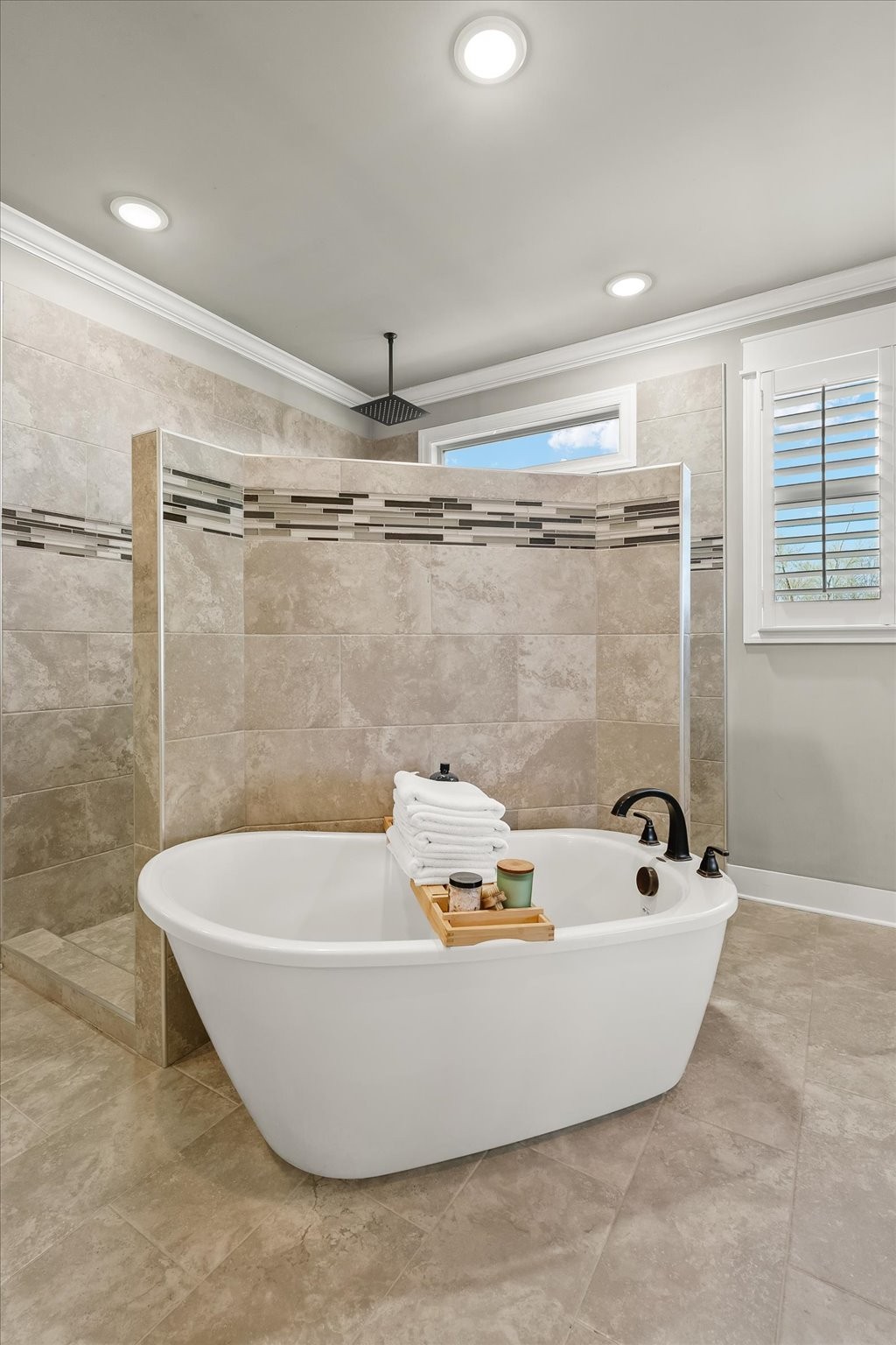 1032 Abbey Rd Way Spring Hill, TN 37174 - Photo 17 of 68 a bathroom with a tub and a shower