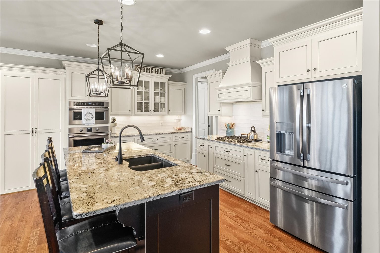 1032 Abbey Rd Way Spring Hill, TN 37174 - Photo 24 of 68 a kitchen with stainless steel appliances granite countertop a refrigerator a stove and a refrigerator