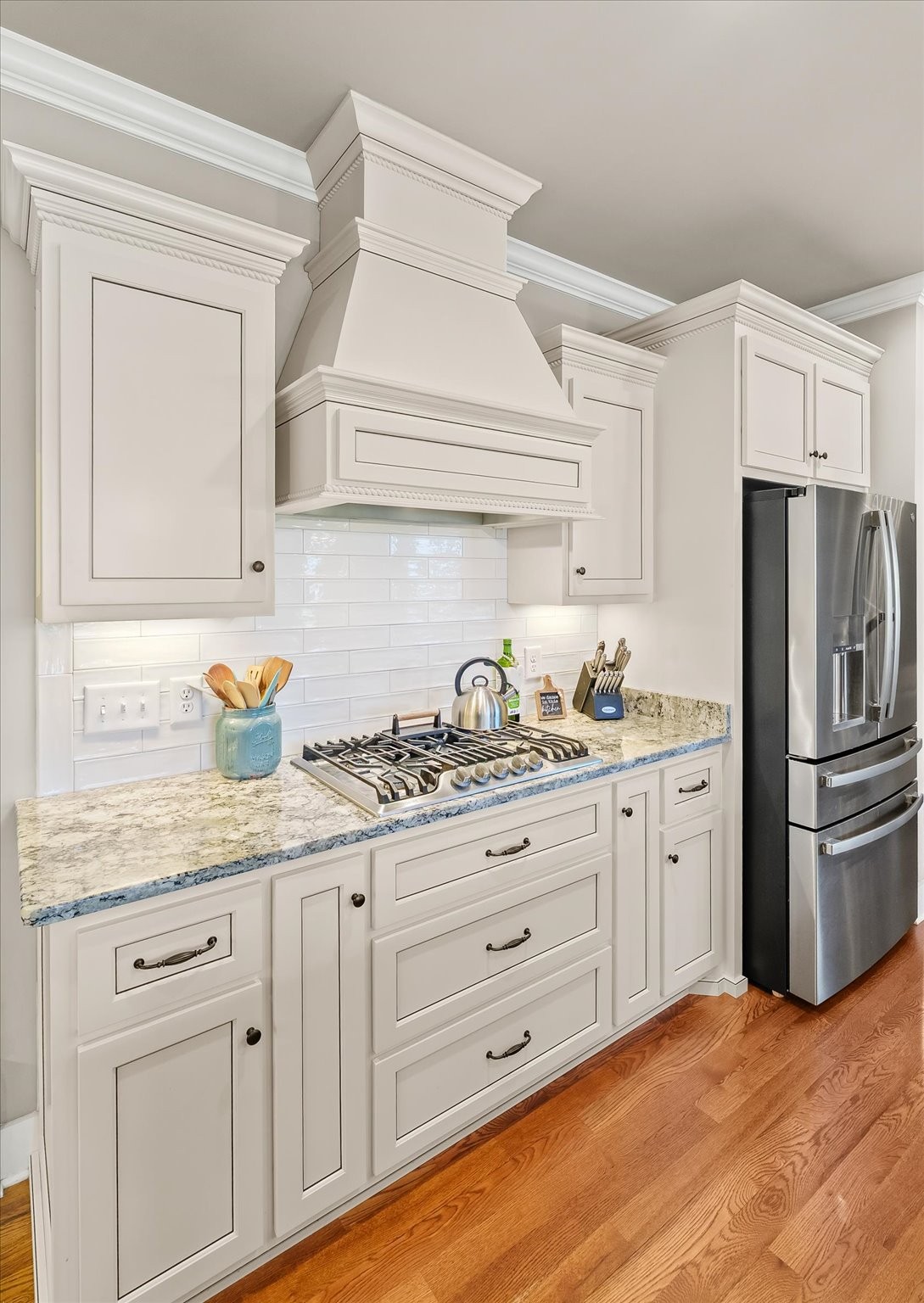 1032 Abbey Rd Way Spring Hill, TN 37174 - Photo 26 of 68 a kitchen with granite countertop white cabinets and stainless steel appliances