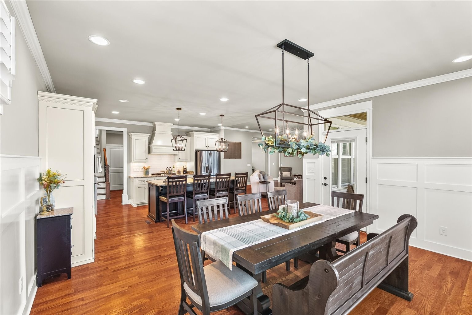 1032 Abbey Rd Way Spring Hill, TN 37174 - Photo 28 of 68 a view of a dining room and livingroom with furniture wooden floor a chandelier