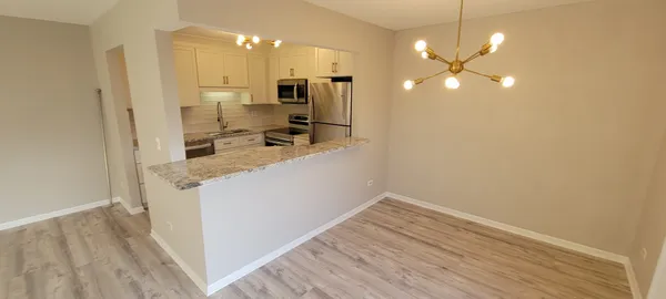 a view of a kitchen from the hallway