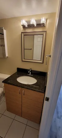 a sink sitting next to a bathroom sink