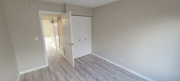 a view of bathroom with wooden floor