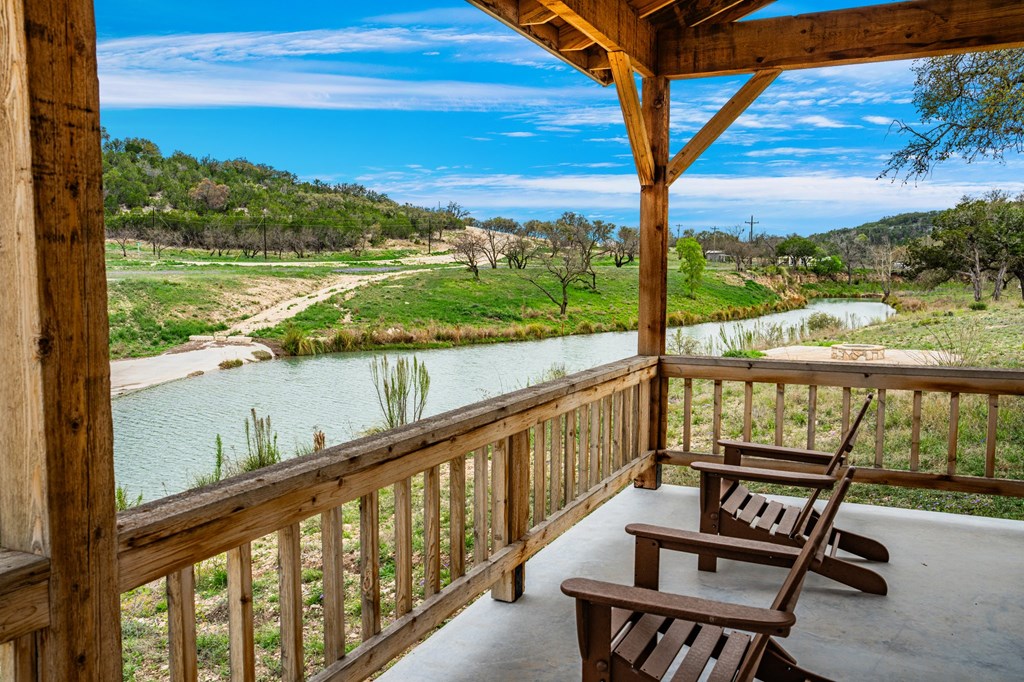 141 Spring Bluff, Unit 32 Junction, TX 76849 - Photo 14 of 16 a view of a two chairs on the balcony