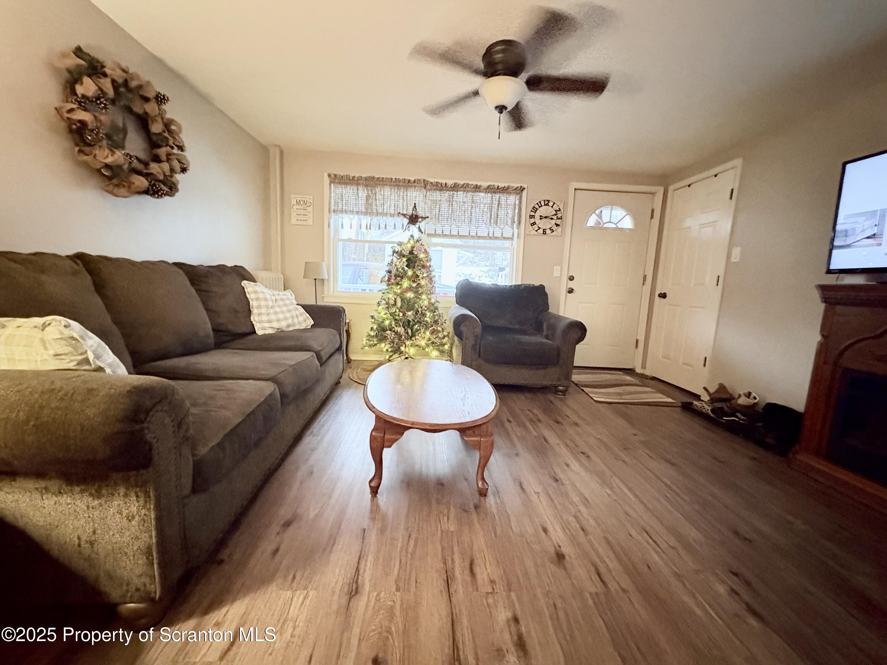 186 Cemetery Street Archbald, PA 18403 - Photo 14 of 28 a living room with furniture and a wooden floor