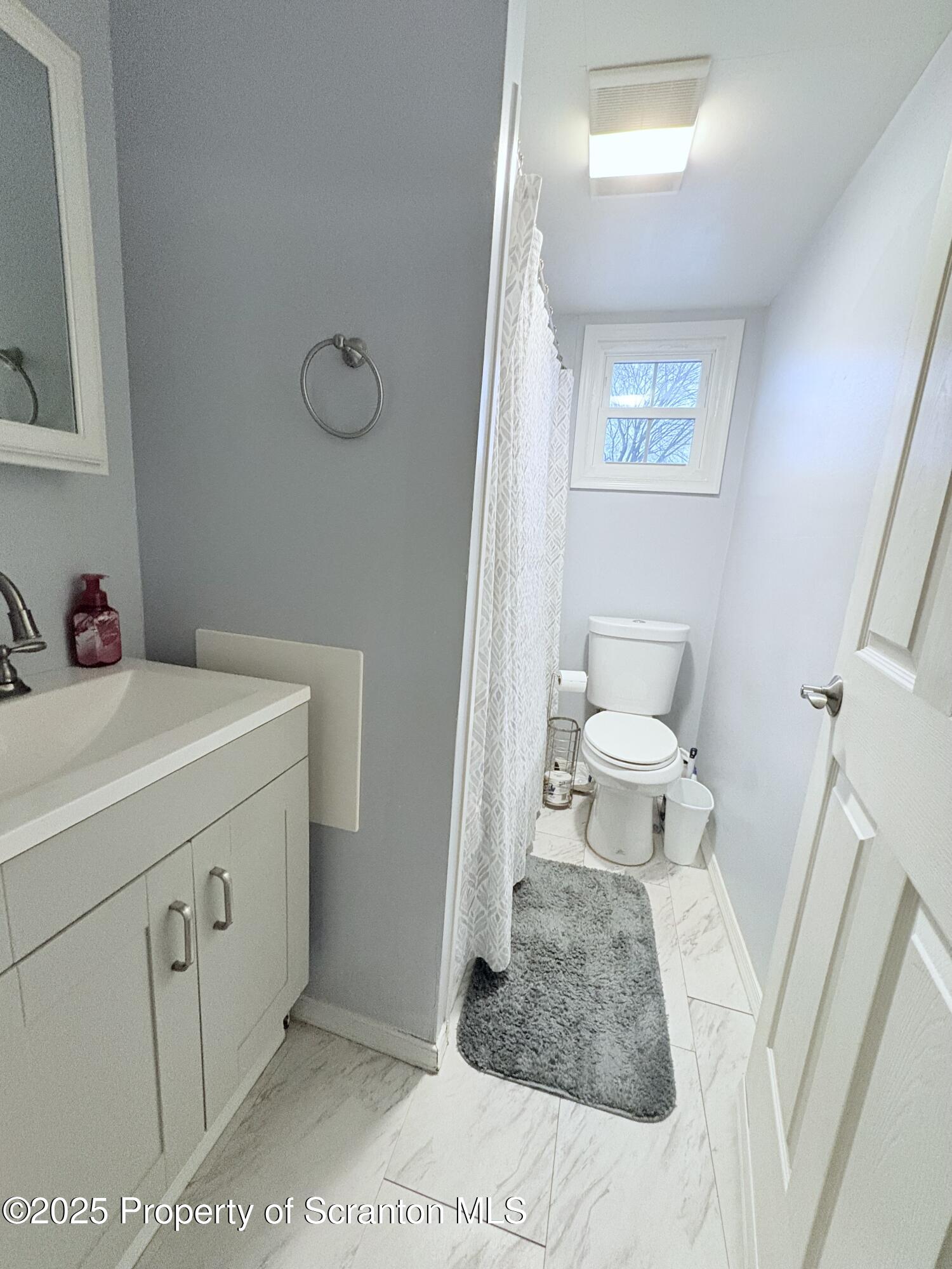 186 Cemetery Street Archbald, PA 18403 - Photo 15 of 28 a bathroom with a sink toilet and a mirror