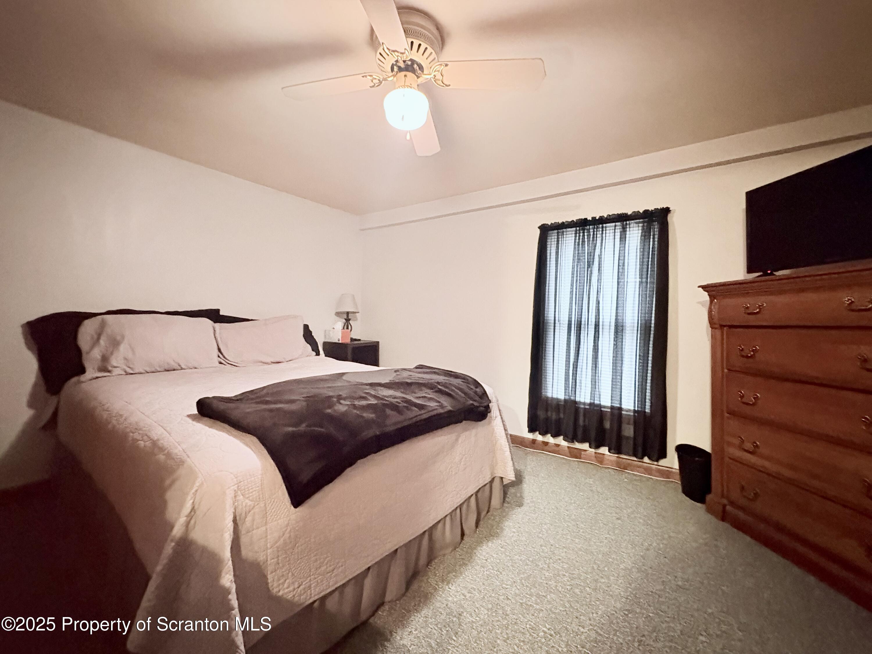 186 Cemetery Street Archbald, PA 18403 - Photo 18 of 28 a bedroom with a bed and a television