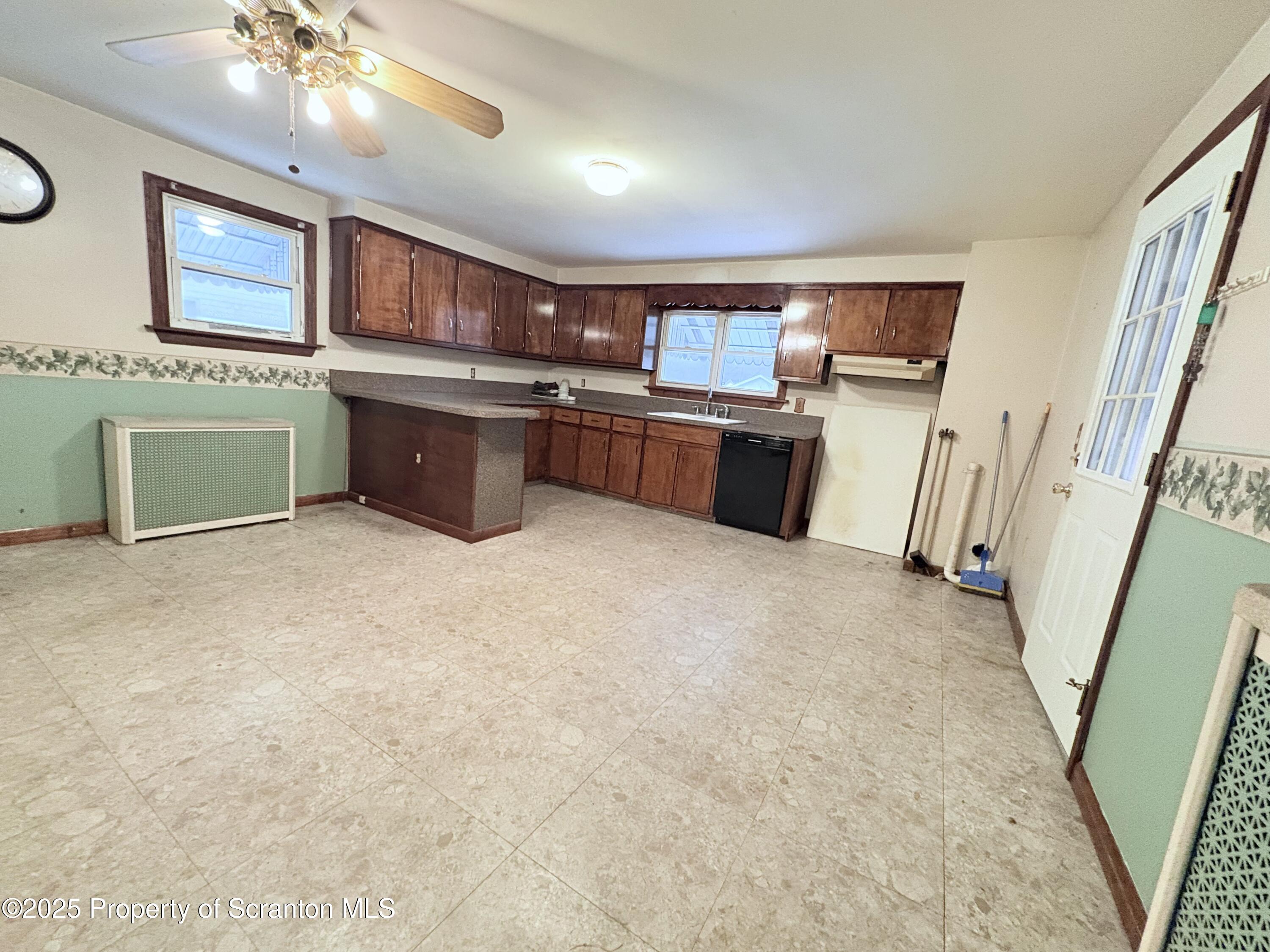 186 Cemetery Street Archbald, PA 18403 - Photo 21 of 28 a kitchen with a sink and cabinets