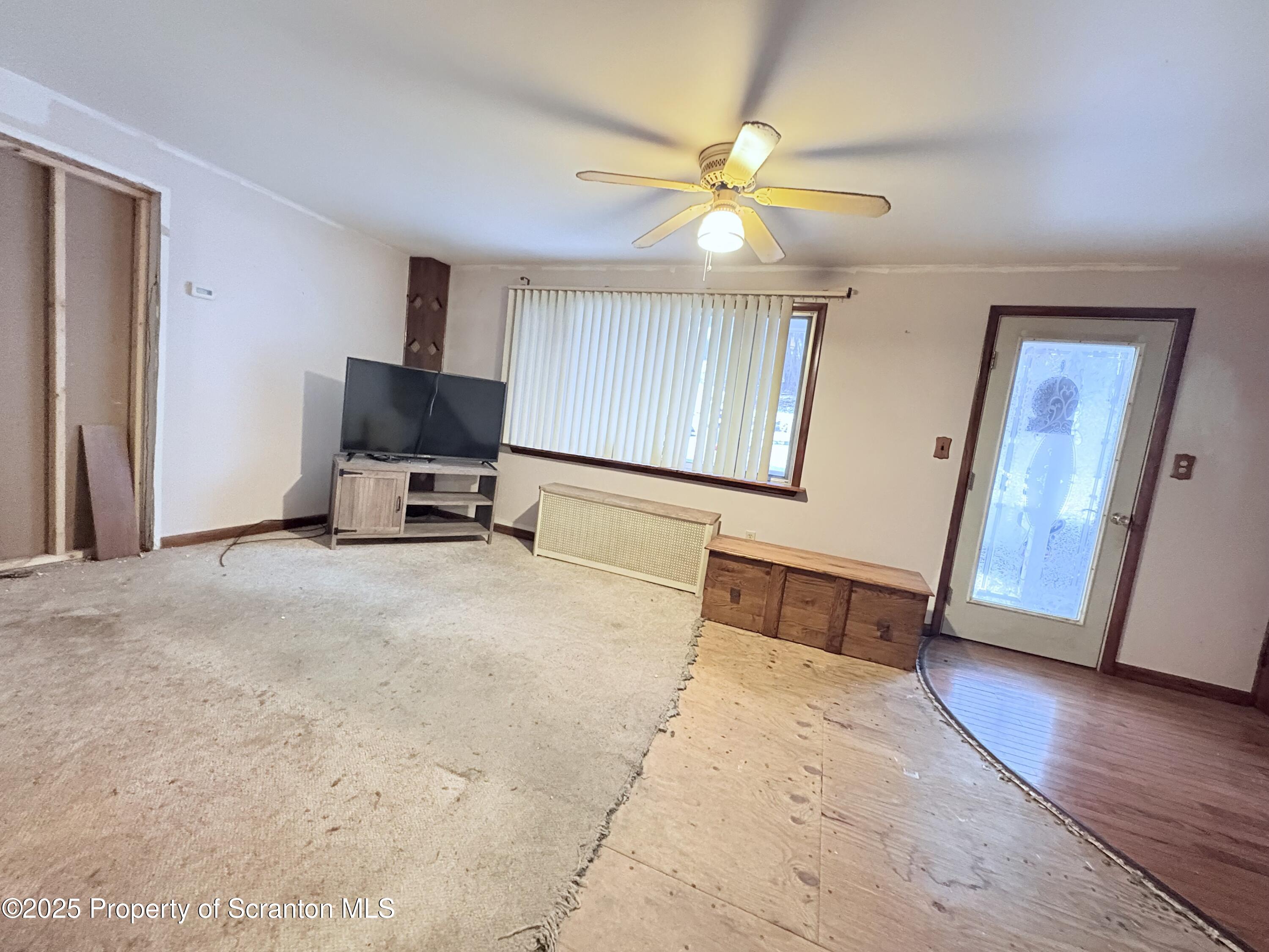186 Cemetery Street Archbald, PA 18403 - Photo 22 of 28 a bedroom with a bed and wooden floor
