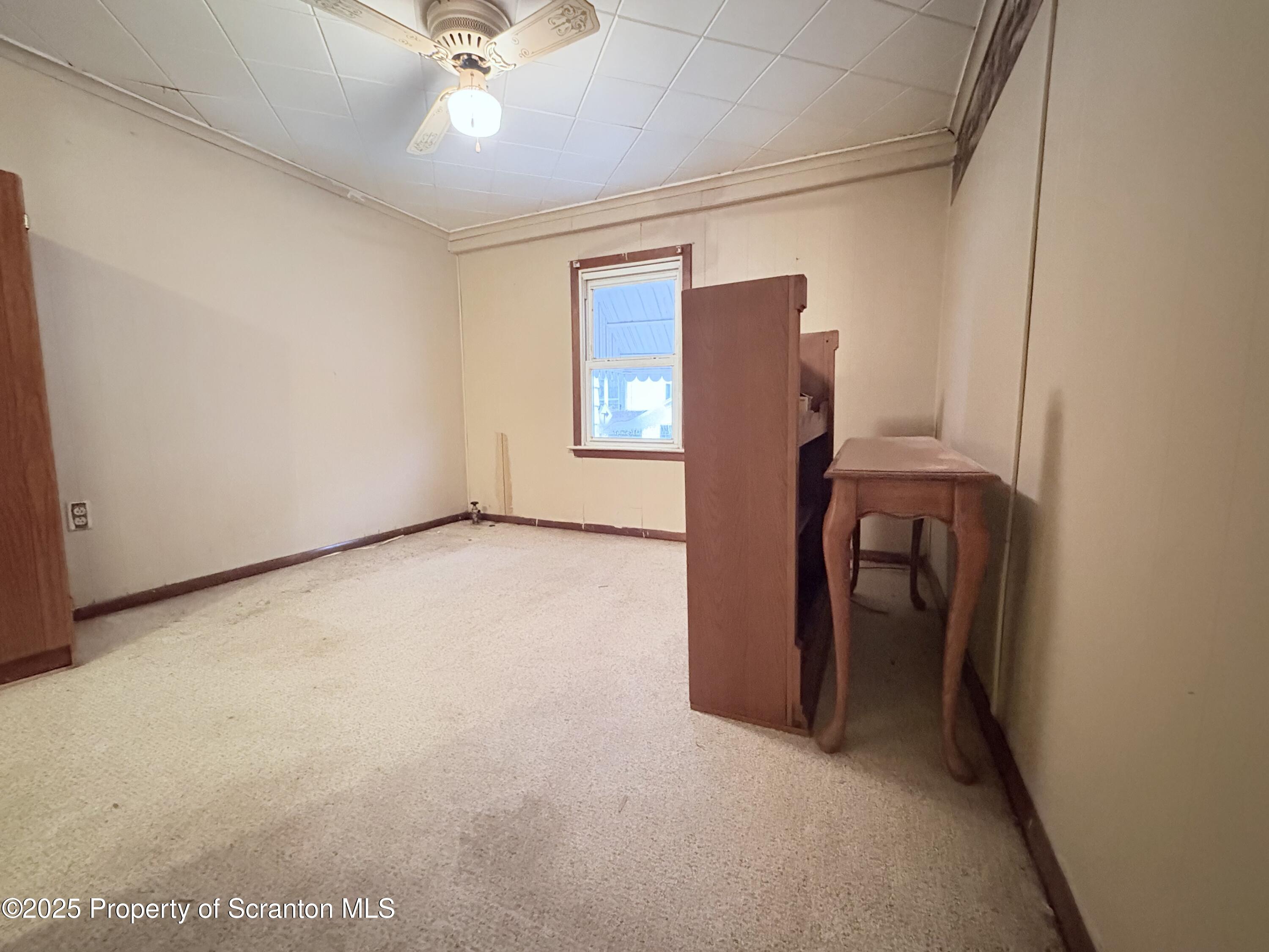 186 Cemetery Street Archbald, PA 18403 - Photo 27 of 28 an empty room with closet and a ceiling fan