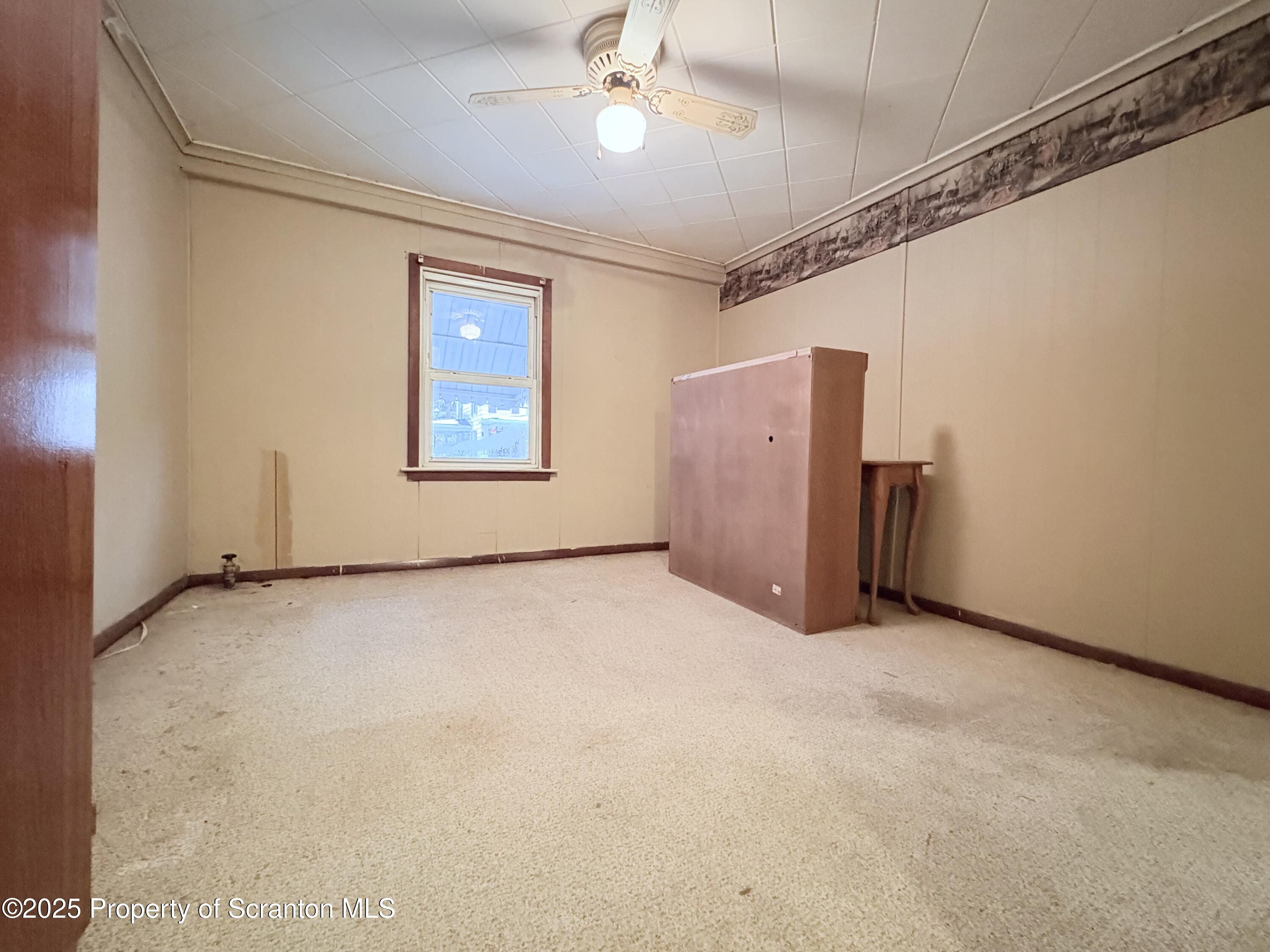 186 Cemetery Street Archbald, PA 18403 - Photo 28 of 28 an empty room with windows and closet