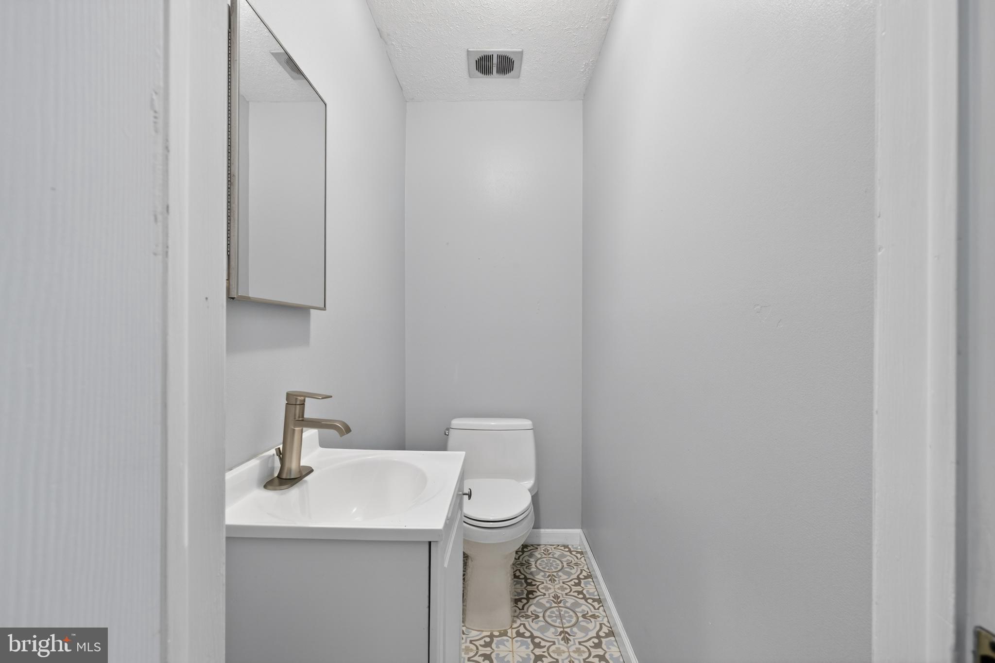 216 Revere Road Marlton, NJ 08053 - Photo 16 of 47 a bathroom with a sink toilet and vanity