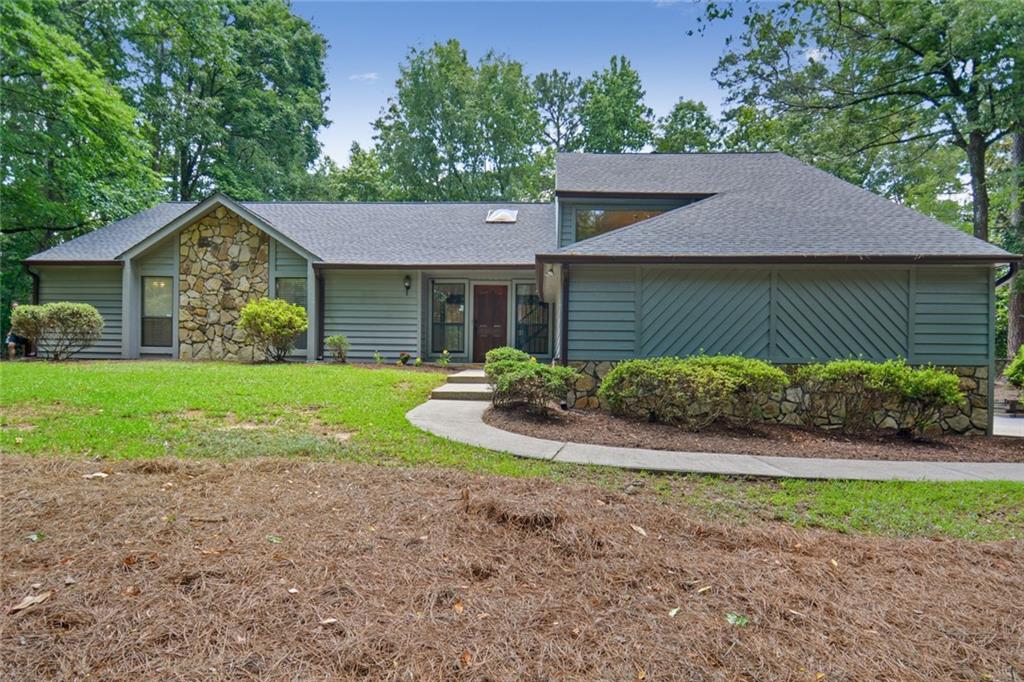 515 Dalrymple Road Sandy Springs, GA 30328 - Photo 1 of 1 a view of a house with yard and a garden