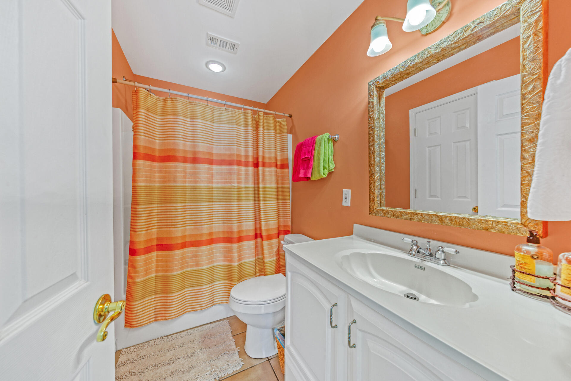 88 East Blue Crab Loop Panama City Beach, FL 32461 - Photo 15 of 55 a bathroom with a sink toilet vanity and shower