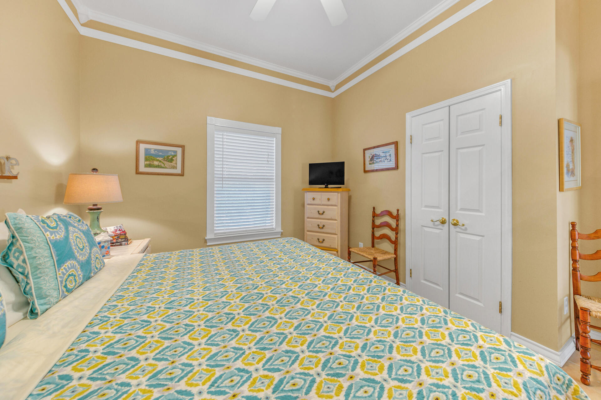 88 East Blue Crab Loop Panama City Beach, FL 32461 - Photo 17 of 55 a bedroom with a bed and a dresser