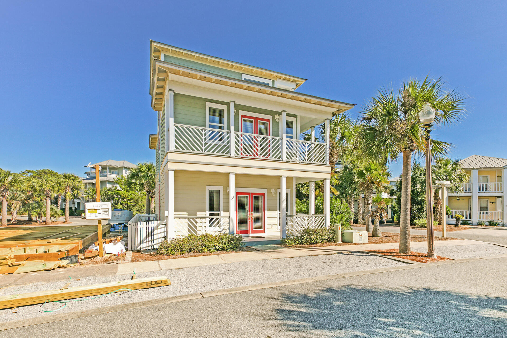 88 East Blue Crab Loop Panama City Beach, FL 32461 - Photo 3 of 55 front view of a building with a street