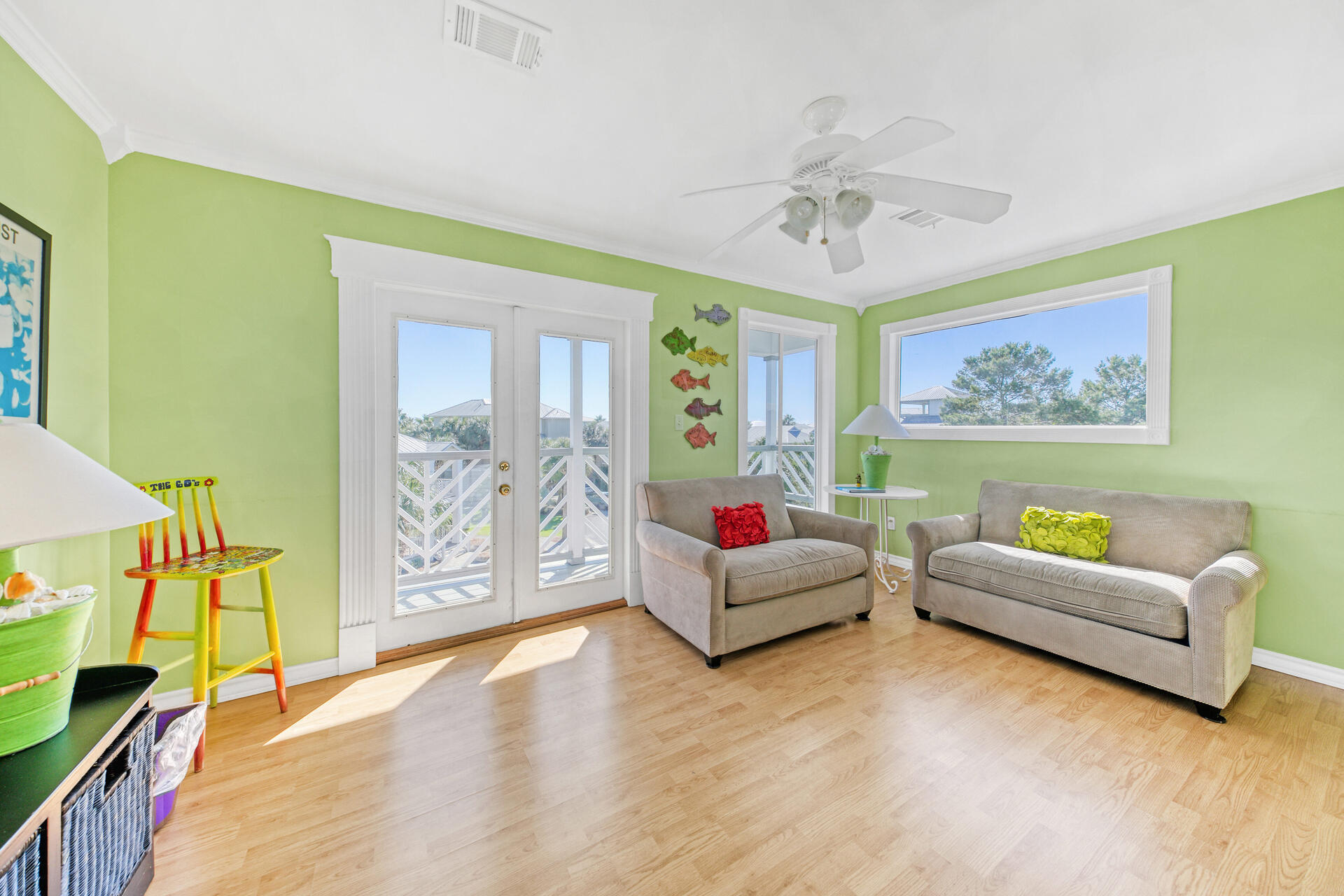 88 East Blue Crab Loop Panama City Beach, FL 32461 - Photo 31 of 55 a living room with furniture and a flat screen tv