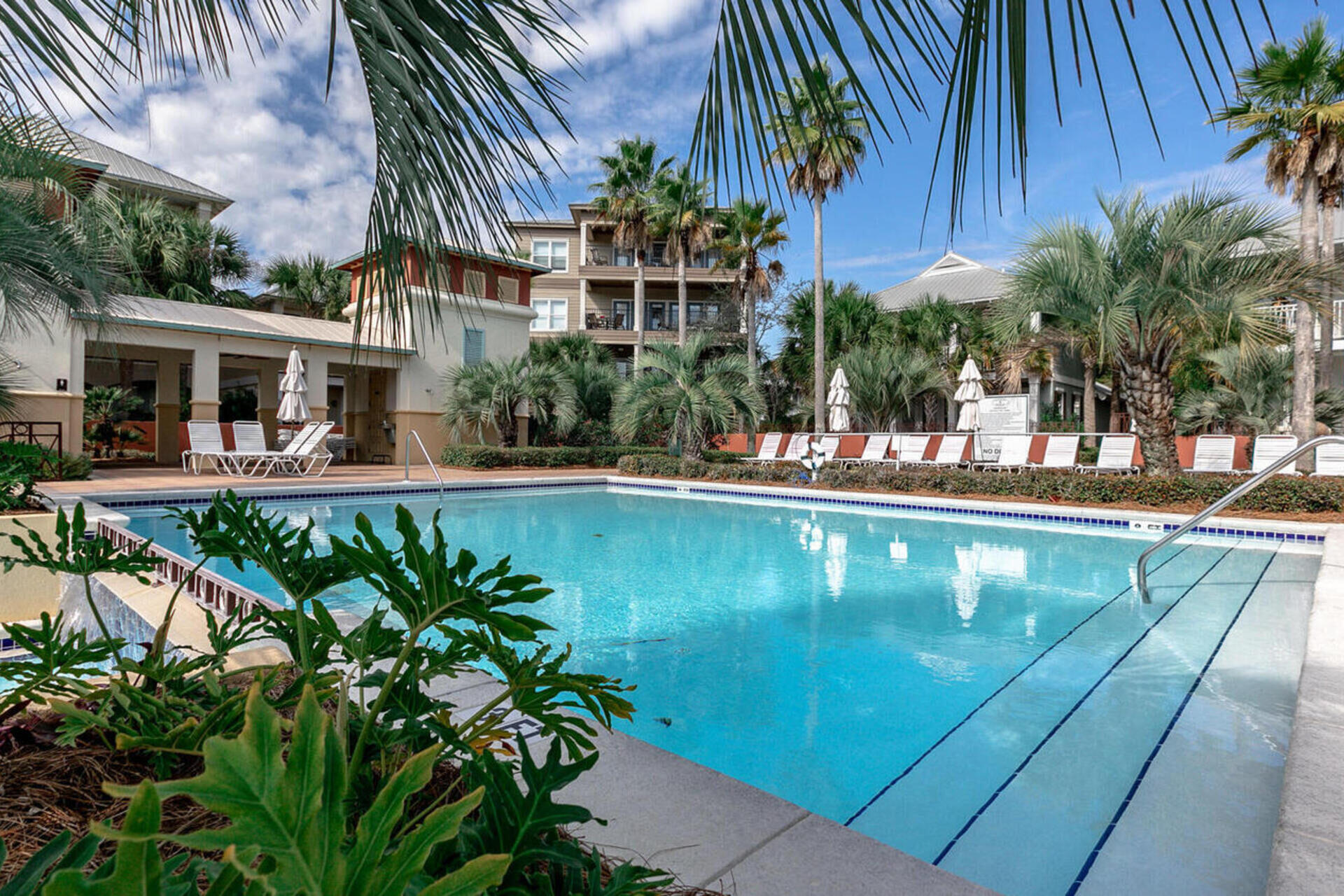 88 East Blue Crab Loop Panama City Beach, FL 32461 - Photo 54 of 55 a view of swimming pool with outdoor seating and plants