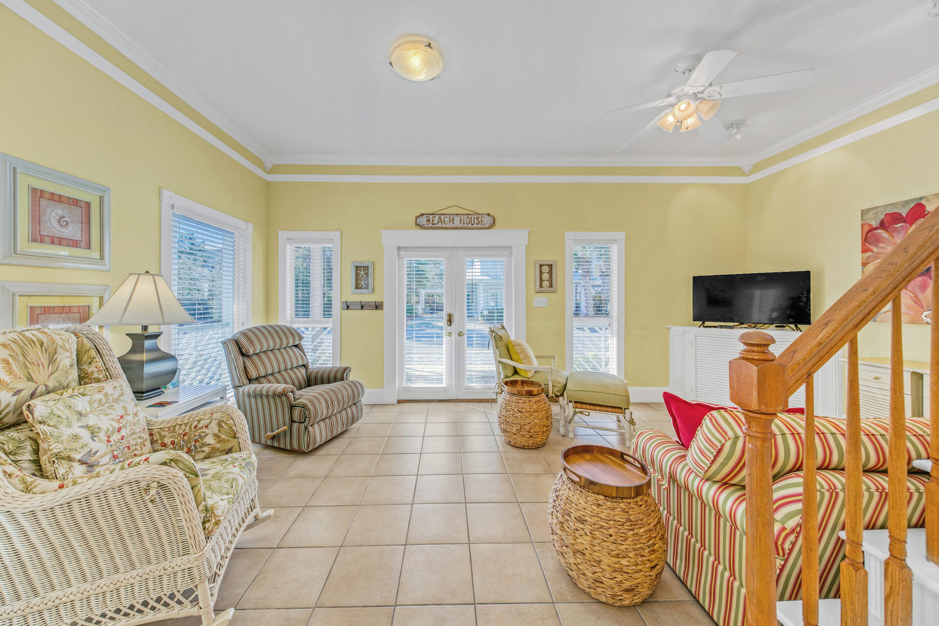 88 East Blue Crab Loop Panama City Beach, FL 32461 - Photo 9 of 55 a living room with furniture and a flat screen tv