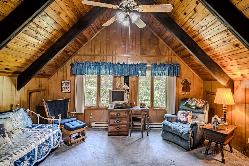 107-109 Shagbark Road Beech Mountain, NC 28604 - Photo 41 of 45 a living room with furniture and a chandelier