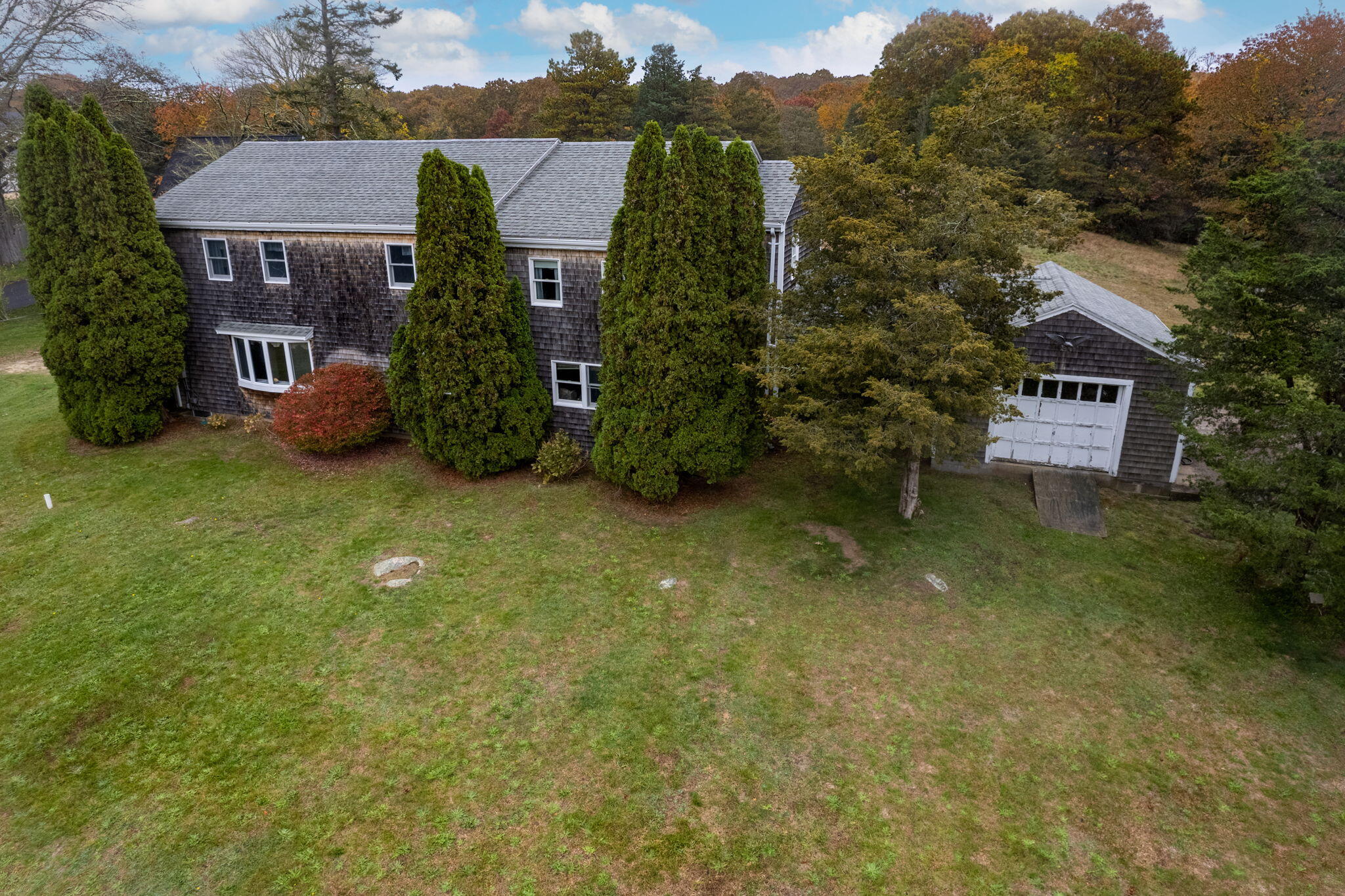 aerial view of a house with a yard