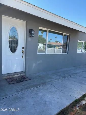 a view of an empty room with a window