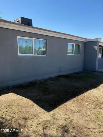 a view of a backyard of the house