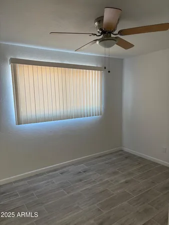 a view of an empty room with a window