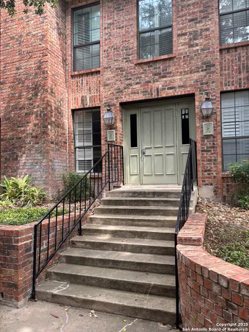 a view of a house with two windows