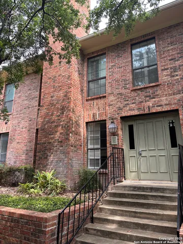 a front view of a house with garage