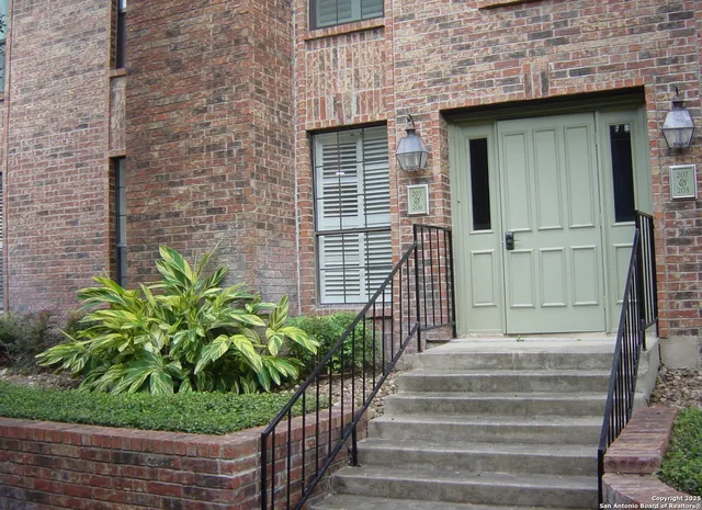 a view of house with yard and green space