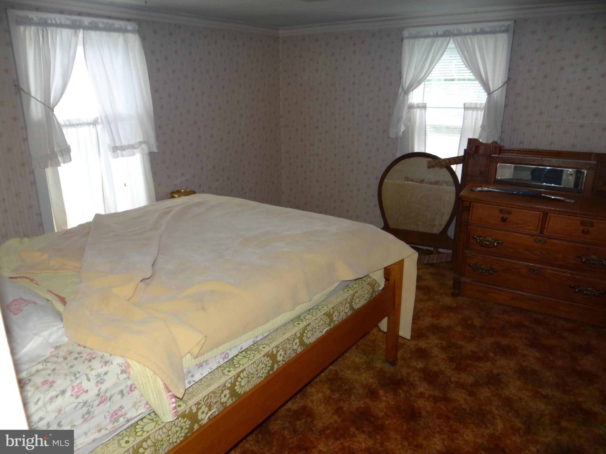 17247 Junkin Road Spring Run, PA 17262 - Photo 20 of 24 a bed sitting in a bedroom next to a window