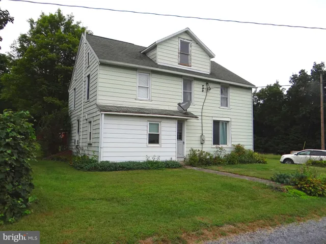 a front view of house with garden