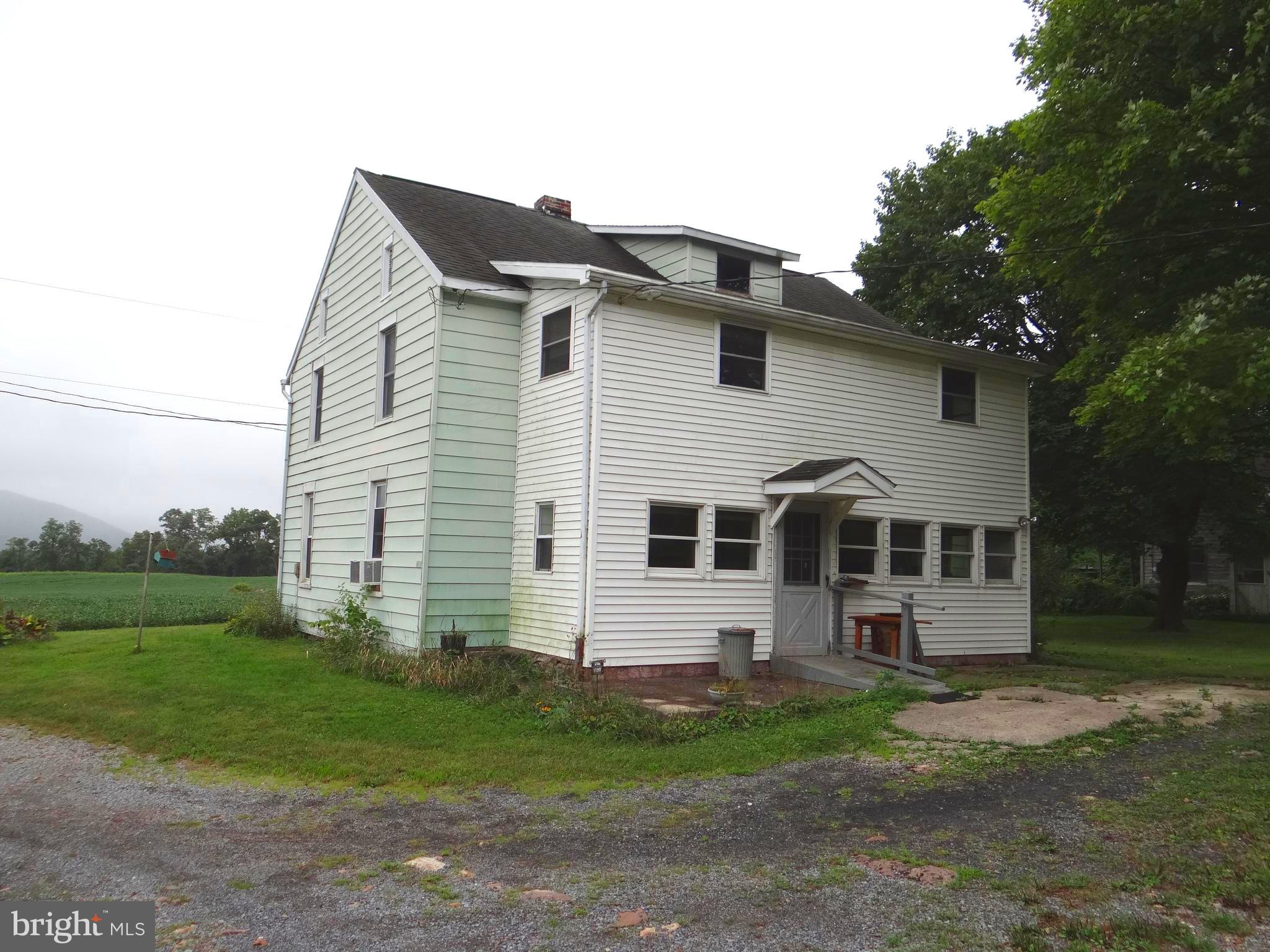 17247 Junkin Road Spring Run, PA 17262 - Photo 5 of 24 a view of a white house next to a yard and large trees