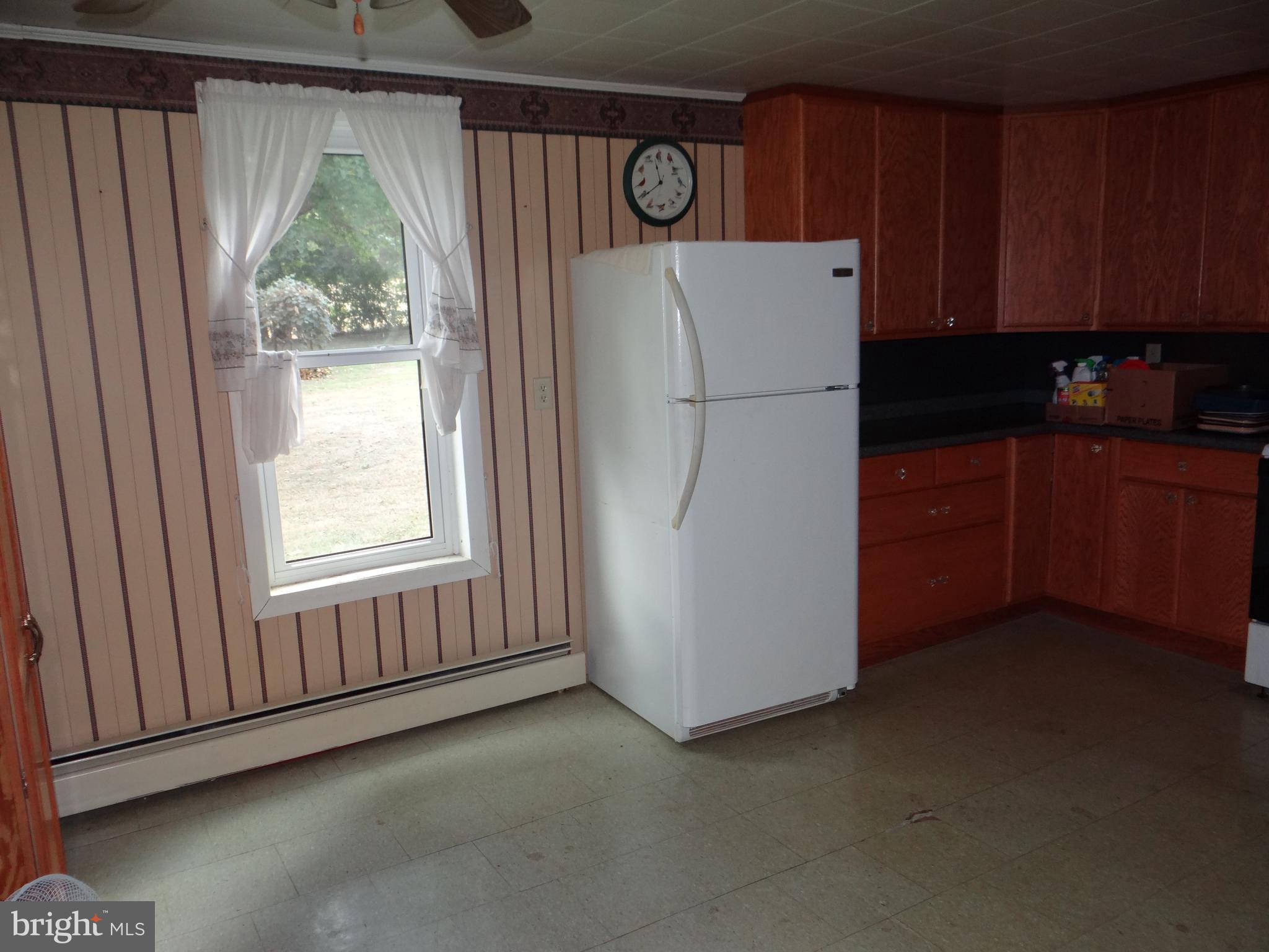 17247 Junkin Road Spring Run, PA 17262 - Photo 10 of 24 a white refrigerator freezer and a dishwasher sitting in a kitchen