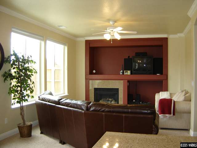 9100 Hummer Drive Reno, NV 89521 - Photo 5 of 9 a living room with furniture and a fireplace