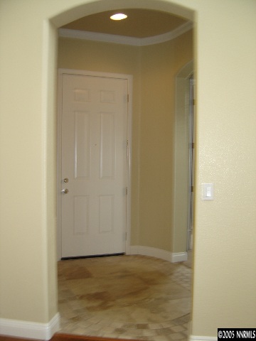 9100 Hummer Drive Reno, NV 89521 - Photo 7 of 9 a view of an empty room with wooden floor