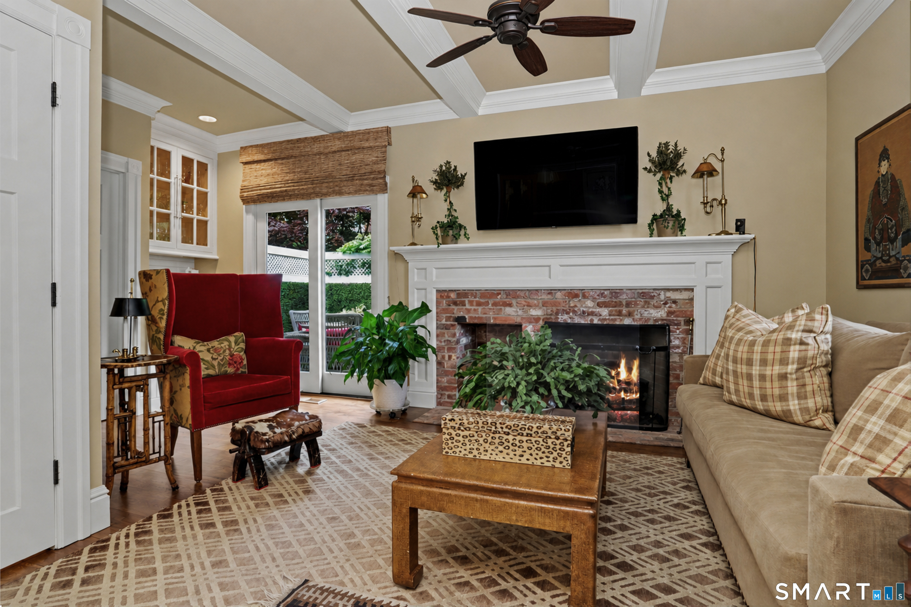 36 Catoonah Street, Unit 18 Ridgefield, CT 06877 - Photo 16 of 40 a living room with furniture a flat screen tv and a fireplace