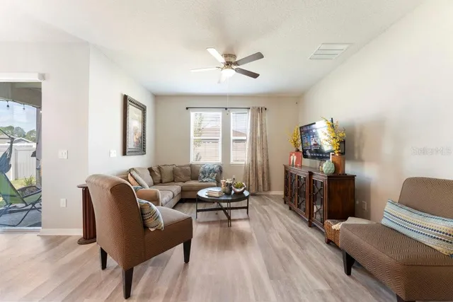 a living room with furniture and a window