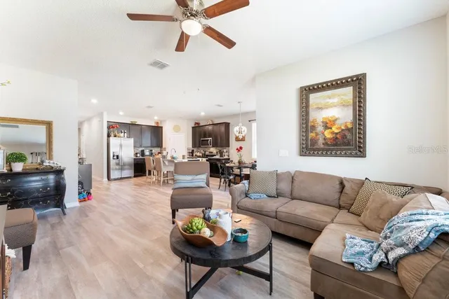 a en suite bathroom with a granite countertop sink and a mirror